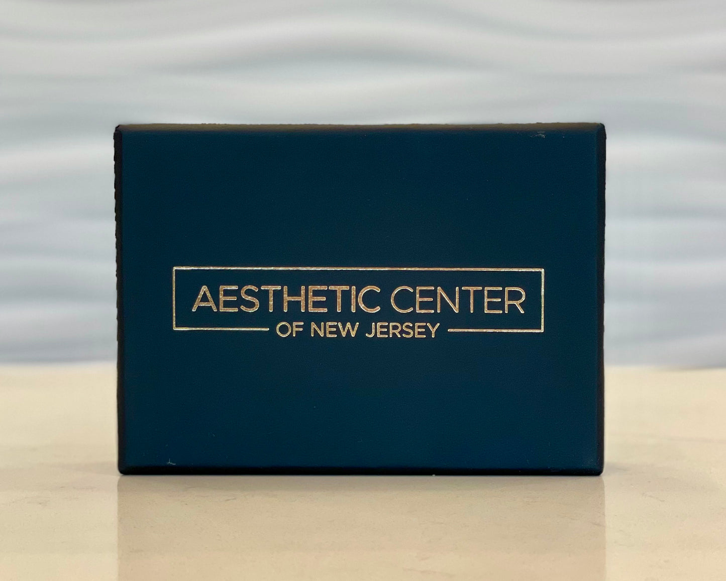 Aesthetic Center of New Jersey gift card box.